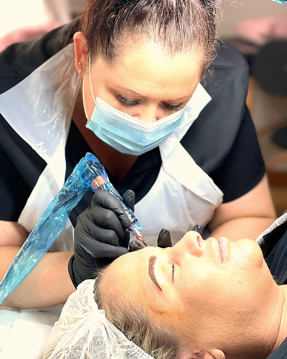 Alison Burns working on a client's brows